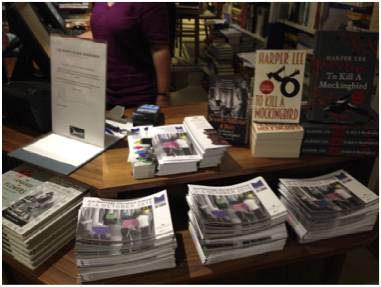 Piles of brochures on the bookshop counter
